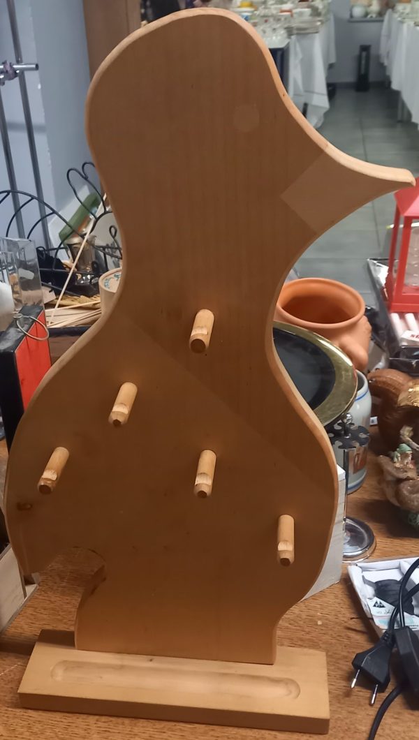 Porte-ustensile en bois en forme d'oiseau.